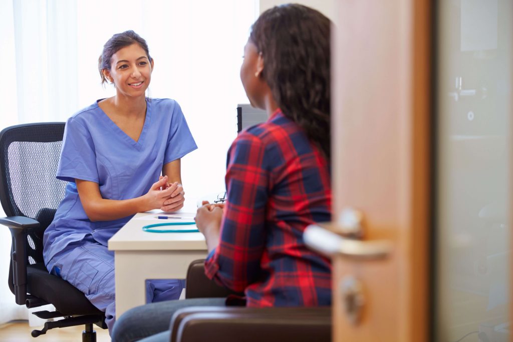 A woman talking to a Dr. about abortion.